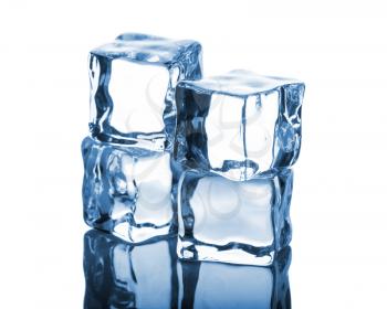 Four ice cubes with reflection on white background