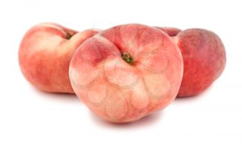 Three paraguayos flat peaches isolated on white background