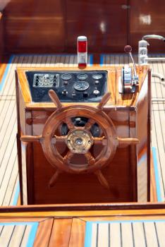 Royalty Free Photo of a Steer and Compass on a Boat