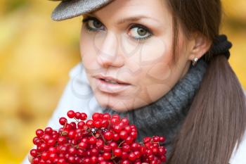 Royalty Free Photo of a Woman Holding Viburnum Berries