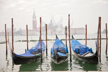 Royalty Free Photo of Gondolas at a Pier in Venice