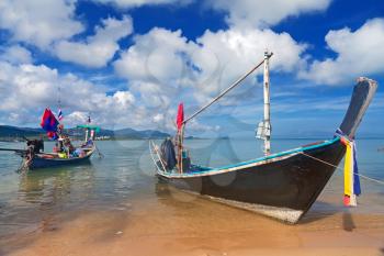 Royalty Free Photo of a Long Thai Boat on a Beach, Koh Samui, Thailand