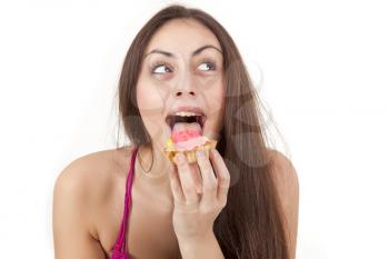 Royalty Free Photo of a Woman Eating a Cupcake