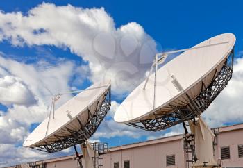 Royalty Free Photo of Satellite TV Antennas on the Roof of a Communication Center