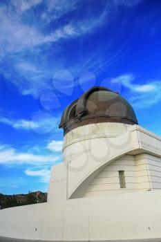 Griffith observatory with blue sky and clouds
