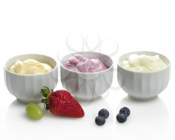 Royalty Free Photo of Fresh Assorted Yogurts with Fruits and Berries
