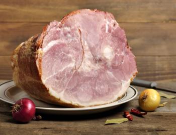 Royalty Free Photo of a Smoked Ham On A Plate