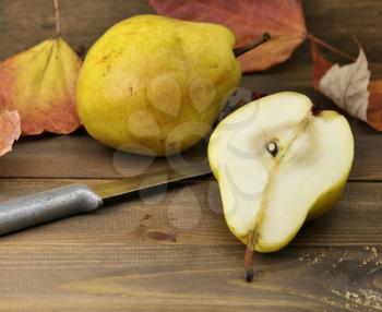 Royalty Free Photo of Yellow Pears on a Cutting Board
