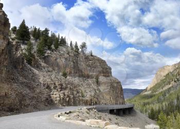 Royalty Free Photo of a Winding Mountain Road In The Yellowstone National Park