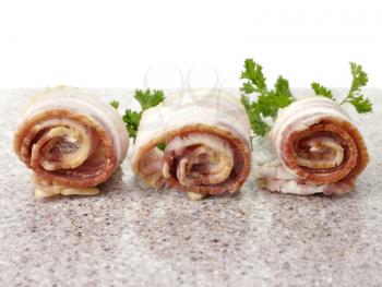 Royalty Free Photo of Sliced Raw Bacon Rolls