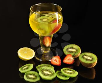 fruit jello in a glass and fresh fruits