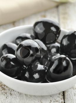 Black Olives In A White Bowl,Close Up