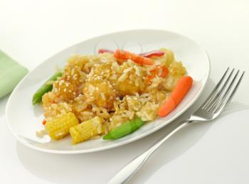 white meat chicken with rice ,vegetables and sesame seeds in a mandarin sauce