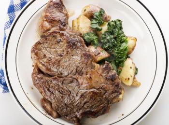  Rib Eye steak with potatoes and spinach