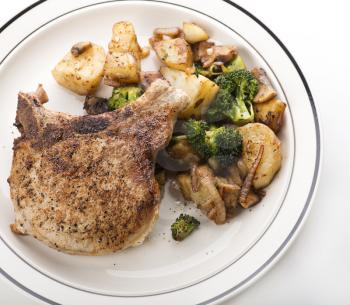 pork chops with potatoes broccoli and onions
