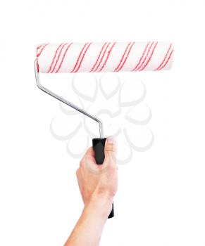 Hand holding roller brush isolated on white