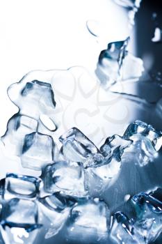 Abstract background with ice cubes over wet glass 