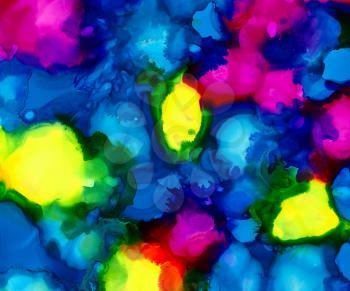 Bright blue paint with pink and yellow spots.Colorful background hand drawn with bright inks and watercolor paints. Color splashes and splatters create uneven artistic modern design.