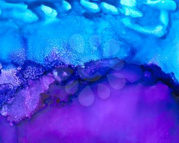 Bright blue purple texture with clouds.Colorful background hand drawn with bright inks and watercolor paints. Color splashes and splatters create uneven artistic modern design.