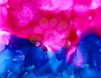 Bright pink deep blue cloudy texture.Colorful background hand drawn with bright inks and watercolor paints. Color splashes and splatters create uneven artistic modern design.