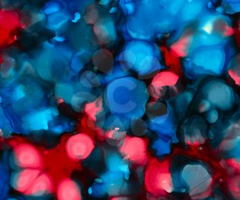 Black blue red spots uneven.Colorful background hand drawn with bright inks and watercolor paints. Color splashes and splatters create uneven artistic modern design.