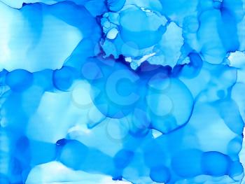 Blue cloudy texture.Colorful background hand drawn with bright inks and watercolor paints. Color splashes and splatters create uneven artistic modern design.