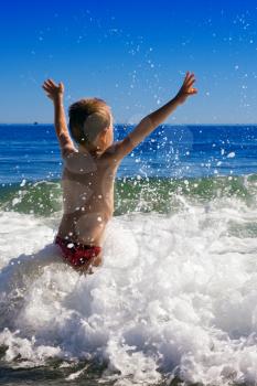 A Young child playing in the sea