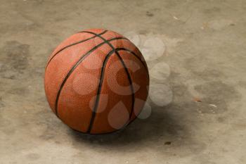 basketball on a cement floor