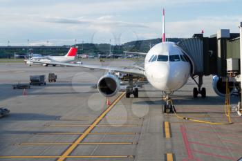 Airplane at an airport with passenger gangway