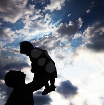 Royalty Free Photo of a Parent and Child Silhouette