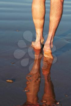 Royalty Free Photo of a Person Walking in Water