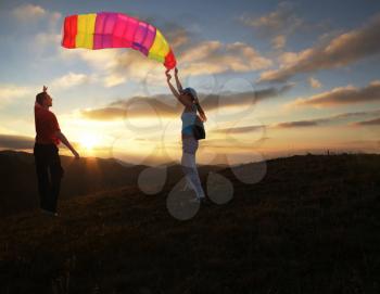 Royalty Free Photo of People Flying a Kite