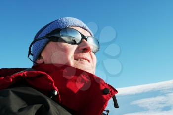 Royalty Free Photo of a Man Wearing Sunglasses and a Winter Coat
