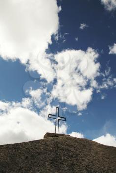 Royalty Free Photo of a Cross on a Hilltop