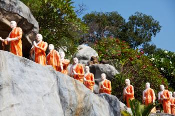 Royalty Free Photo of Statues of Buddhist Monks at the Rock Temple  Dambulla, Sri Lanka