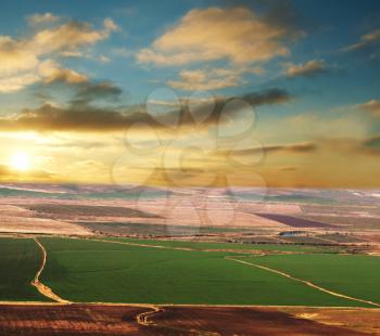 Royalty Free Photo of an Aerial Shot of Fields at Sunset