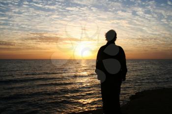 Royalty Free Photo of a Female Silhouette At Sunset