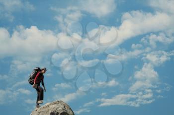 Royalty Free Photo of a Woman on a Rock Summit
