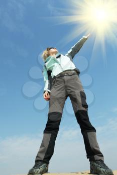 Royalty Free Photo of a Woman Reaching Up