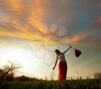 Royalty Free Photo of a Woman Holding a Balloon