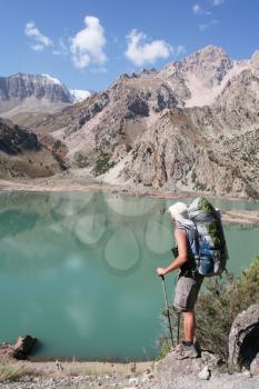 Royalty Free Photo of a Backpacker at a Mountain Lake