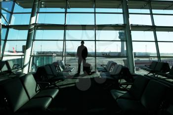 Royalty Free Photo of a Man Standing in an Airport