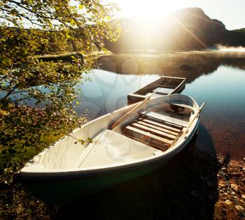 Royalty Free Photo of a Boat on a Mountain Lake