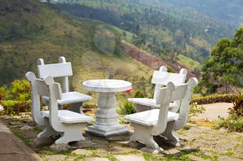Royalty Free Photo of a Table and Chairs in a Garden