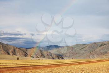 Royalty Free Photo of Rainbow in the Prairies and Mountains