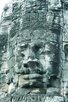 Royalty Free Photo of Gigantic Face Statues On The Bayon Temple In The Walled City/ruin Of Angkor Thom At The Unesco World