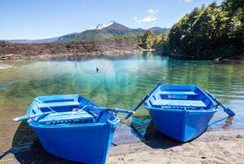 Boat on beautiful lake in Chile mountains 