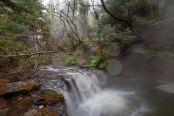 Thermal waterfall on Kerosene creek, Rotorua, New Zealand. Unusual natural landscapes
