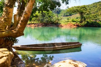 Wooden boat in beautiful green river in Guatemala, Central America
