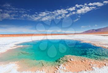 Salt water pool in Salinas Grandes Salt Flat - Jujuy, Argentina. Unusual natural landscapes.